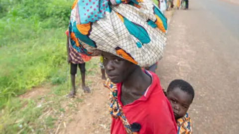 Person with a child on their back