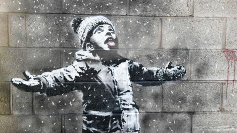 Close up of Banksy artwork Seasons Greetings