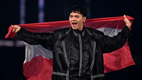 JJ holds aloft an Austrian flag