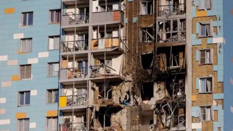 Reuters Outside of an apartment block in Moscow damaged by Ukrainian drones