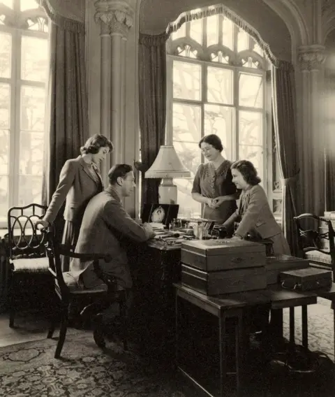 Cecil Beaton The Royal Family, in 1943, pictured around King George VI's desk