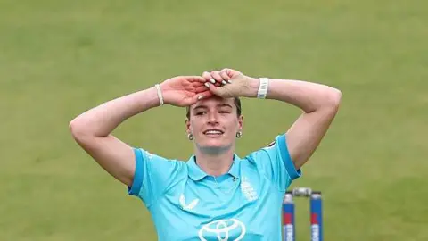 Lauren Bell looks frustrated while bowling for England