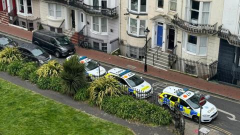 A street with police cars in Brighton