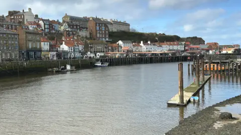 A view across Whitby harbour towards the buildings on the other side of the water