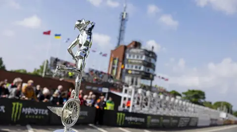 IOM TT A silver TT trophy in front of the grandstand.