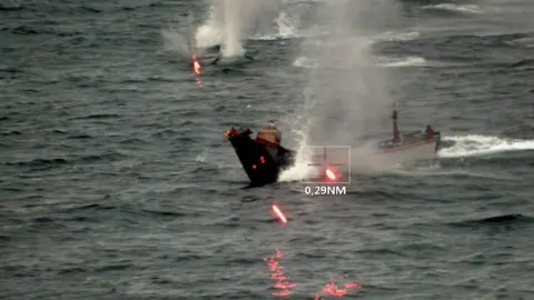 EPA EUNAVFOR handout showing an unmanned surface vessel (USV) being destroyed by one of its warships in the Red Sea (21 August 2024)