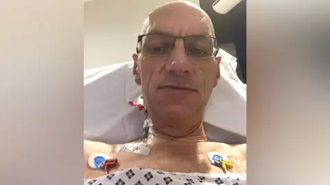 Sturman family Paul in hospital with pads connected to his chest