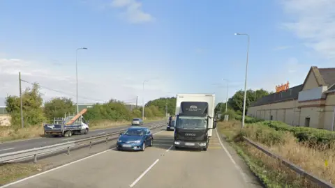 A Google Maps image shows several vehicles passing the Sainsburys near Biggleswade
