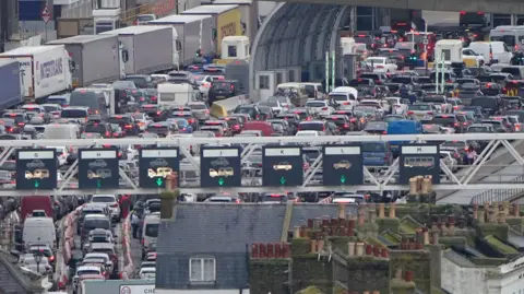 Cars queue at the border while waiting to board ferries at the Port of Dover in December 2025