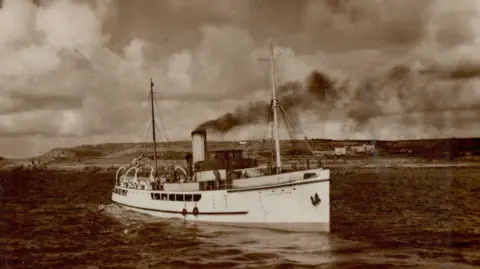 Isles of Scilly Steamship Group A black and white picture of Scillonian I she has a white hull, black smoke billows from her funnel 