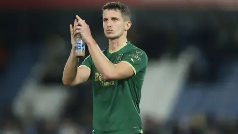 Jordan Houghton applauds the Plymouth fans 