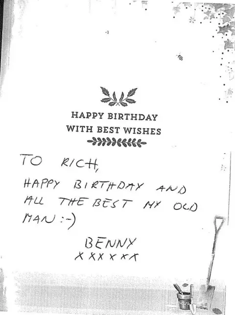 GMP A white card with the words 'happy birthday with best wishes' in black text. There is also hand written notes on the birthday card which reads: "To Rich, happy birthday and all the best my old man" it is signed off from "benny" which is a nickname Mr Everett was known by