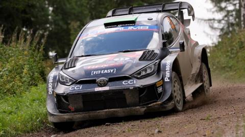 Elfyn Evans takes a corner in Finland