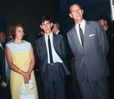 Getty Images Prince Charles, seen here with his father and sister, took a moment to speak to reporters at New York's Kennedy airport during a stopover on their way back to London after attending the Commonwealth Games in Jamaica
