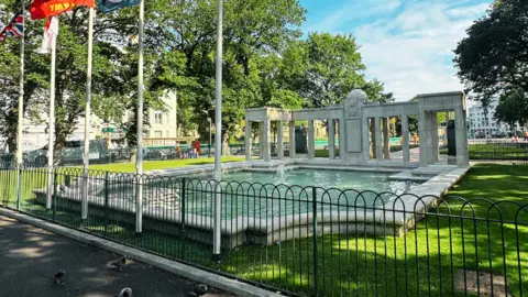 Brighton & Hove City Council A war memorial in a city centre. 