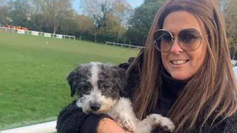 Lucy Bestwick holding her dog Nellie before her death