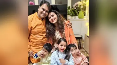 Derby Hindu Temple Dr Prateek Joshi, his wife and three children