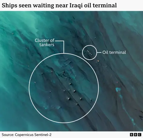satellite imagery showing a group of ships moored off Iraq near to an offshore oil terminal 