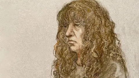 Elizabeth Cook via PA Court sketch of Ms Pexton wearing a tracksuit and looking unhappy. She has long brown straggly hair.