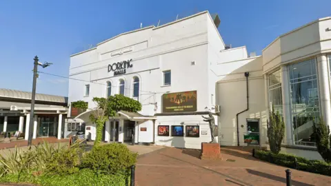 The façade of a theatre. 