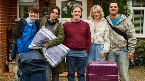 BBC/Baby Cow/Rob Baker Ashton Left to right: Harry Baxendale, Yasmin Al-Khudhairi, Rob Brydon, Ada Player, Dylan Brady
