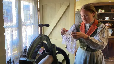 The Mechanics Institute One of the actors dressed as Mrs Smith at the cottage at the Railway village