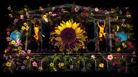 A light show which shows flowers and people dancing between a CGI image of Nottingham's Council House.