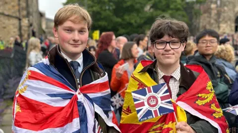 Matthew Lamb and Daniel Kirk with flags around their shoulders