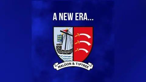 Maldon & Tiptree FC The old logo shows a ship on one side, and another side which is red with white and yellow swords. 