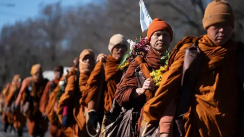 Buddhist monks seen walking on their trek from Fort Worth, Texas to Washington DC