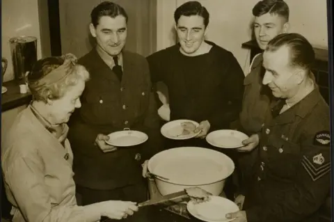 Getty Images The Silver-Haired Lady At The Beaver Club, cooking for the soldiers at the club and serving them food