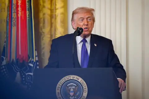 Trump speaks at a ceremony.