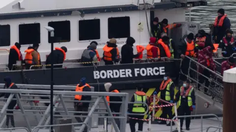 A group of people thought to be migrants are brought in to the Border Force compound in Dover, Kent, from a Border Force vessel following a small boat incident in the Channel. 