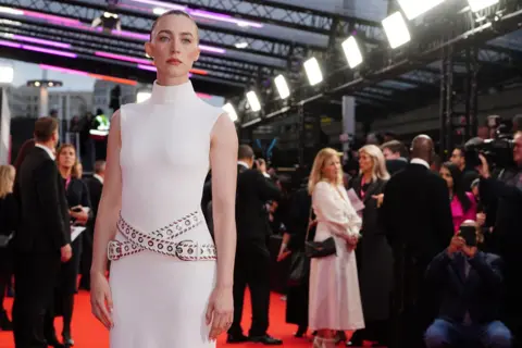 PA Media Saoirse Ronan attends the opening gala of the BFI London Film Festival with documentary filmmaker and director Steve McQueen's Second World War drama Blitz, at the Royal Festival Hall, Southbank Center in London. Picture date: Wednesday October 9, 2024