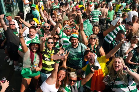 PA Media Fans took advantage of the tropical weather as they partied on the streets