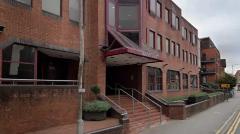 A Google Maps picture of Regents Gate in Reading, a three-storey office block on a roadside.