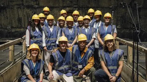 Uniper A group of people in yellow hard hats and blue vests