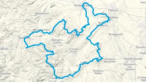 Cycling UK An overhead view of an interactive map, that displays the route of the cycle path. The route is marked out in blue, and runs through Shrewsbury, Much Wenlock, Ludlow, Prestigne, Knighton, Clun, Newtown, Montgomery and Church Stretton, before the loop is completed in Shrewsbury.