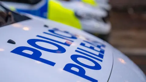 White bonnet of a Police Scotland van with Police written in blue in English and Gaelic