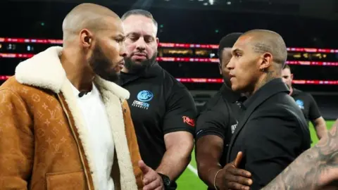 Chris Eubank Jr and Conor Benn face off, but are held back by security