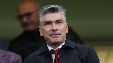 Richard Hughes at a Liverpool game