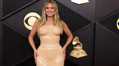 Getty Images Supermodel Heidi Klum in a flesh-toned dress
