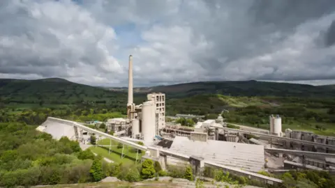 Cement plant with hillside backdrop