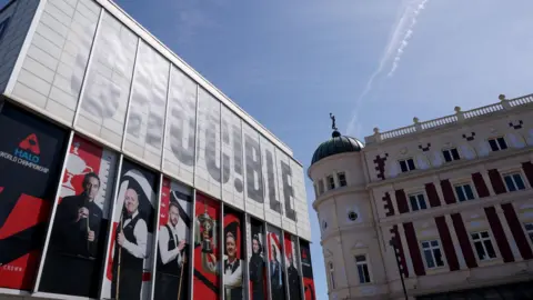 Two grand theatres side by side in the sunshine