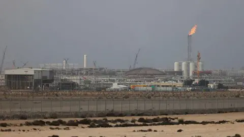 AFP via Getty Images The Ras Laffan gas complex, with flames coming out of an exhaust tower