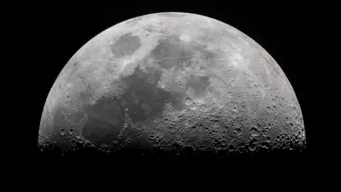 Getty Images Close up image of the moon in black and white showing details of craters