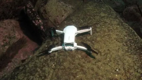 Caithness Diving Club The drone on a rock underwater