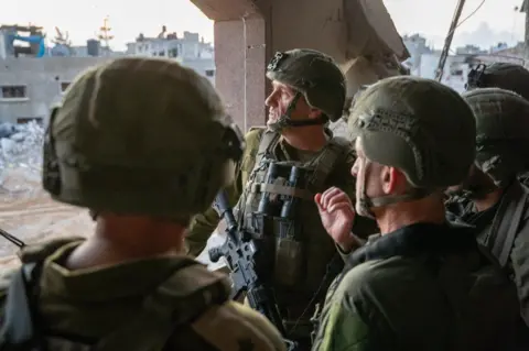 Israeli IDF military commanders visit the scene where Sinwar was killed