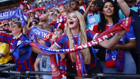 Supporters of Crystal Palace celebrate winning the FA Cup Final in Wembley Stadium.