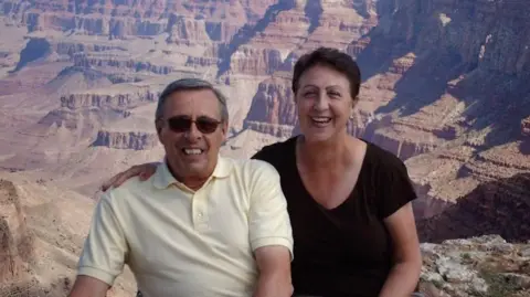 Carole and Geoffrey Geoffrey and Carole Murrell smiling in front of some canyons